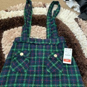 A green overall dress